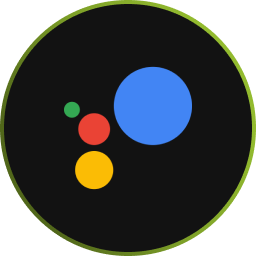 A black circle with a thin green outline contains four colored dots: a large blue dot, a smaller red dot, a small yellow dot, and a tiny green dot, resembling the Google Assistant logo.